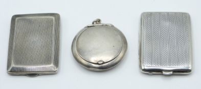 Two hallmarked silver match cases, Birmingham 1926 and 1928 and a small hallmarked silver compact,