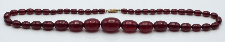 Cherry amber graduated bead necklace made up of 45 oval beads, 45g