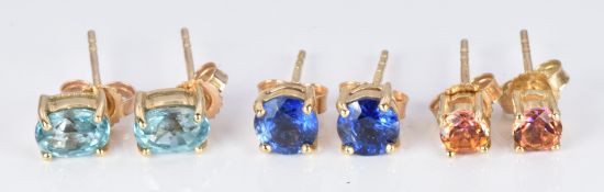 Three pairs of 9ct gold earrings set with twilight topaz, aquamarine and blue topaz