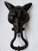 A vintage cast iron fox mask door knocker and stop, height 24.5cm.