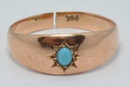 A 9ct rose gold ring set with faux turquoise, 2.5g