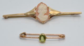 A 9ct gold brooch set with a peridot and a 9ct brooch set with a cameo, 5.3g