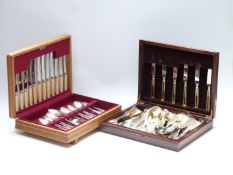 Two six place setting canteens of cutlery, one gold plated