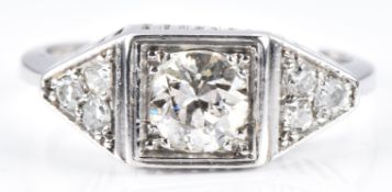 Art Deco platinum ring set with a diamond of approximately 0.7ct and three futher diamonds to each
