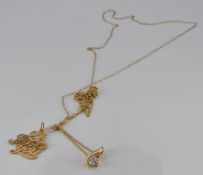 A 9ct gold necklace and pendant together with a 9ct gold 'I Love You' pendant, 2.3g