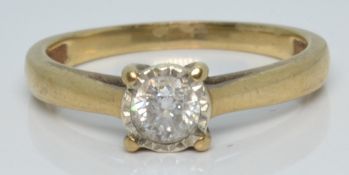 An 18ct gold ring set with a diamond of approximately 0.3ct in an illusion setting, 2.2g, size N