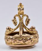 A 9ct gold fob set with a citrine with embossed decoration