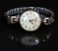 Unnamed 9ct gold ladies wristwatch with blued hands, black Arabic numerals, gold and silver dial and