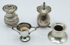 Four hallmarked silver and white metal items comprising pepper, Birmingham 1915, small trophy cup,