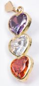 A 14ct gold pendant set with three heart cut quartz, 2.6g