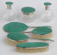 Art Deco green guilloché enamel and hallmarked silver mounted dressing table set, comprising three