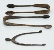 Two pairs of Georgian hallmarked silver sugar tongs, one bright cut circa 1800, maker Thomas