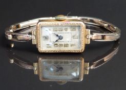 Art Deco style 9ct gold ladies wristwatch with blued hands, gold Arabic numerals, silver dial,