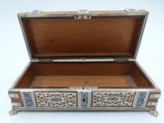 A 19thC wooden glove box with carved bone decoration, raised on lion pad feet, W20 x D9 x H6cm