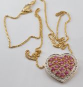 A 9ct gold heart pendant set with rubies and diamonds, on 9ct gold chain, 4.3g
