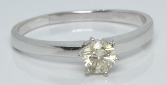 A 14k white gold ring set with a round cut diamond of approximately 0.3ct, 2.7g, size S
