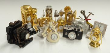 A collection of miniature novelty clocks in the form of cameras, telephones, household items etc