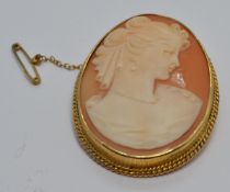 A 9ct gold brooch set with a cameo with rope twist border, 3 x 4cm