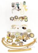A collection of costume jewellery including two white metal brooches, a two strand pearl necklace,