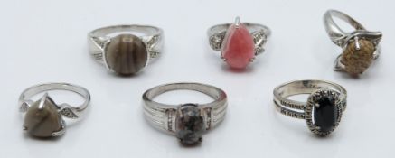 Six silver rings set with flint & white sapphire, rhodochrosite & zircon, flint & diamond,