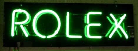 Rolex green neon ex shop display or advertising sign mounted on a black acrylic board, 75 x 25cm