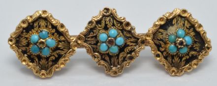 Victorian brooch set with three turquoise clusters on a black enamel ground within a foliate gold