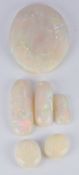 Three elongated opal cabochons and three oval opal cabochons
