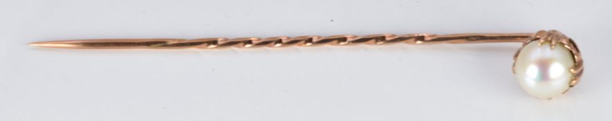 A 9ct rose gold stick pin set with a pearl, in vintage box