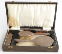 Hallmarked silver mounted dressing table set, comprising hand mirror, two brushes and comb,