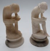 Two alabaster Grand Tour figurines of seated ladies, raised on circular bases, height 15cm