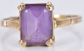 A 9ct gold ring set with an emerald cut amethyst, 2.4g, size N