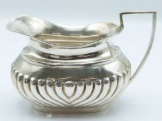 Edward VII hallmarked silver milk jug with reeded lower body, Sheffield 1902 maker Cooper Brothers &