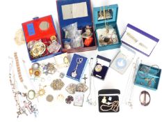 A collection of jewellery including ceramic cameo, belt buckles, silver pendants, silver chains,