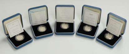 Five Royal Mint silver proof £1 coins, 1999, 2000, 2001 and two for 2002, cased with certificates