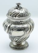 Edward VII hallmarked silver covered pedestal tea caddy with wrythen moulded and repoussé floral