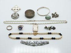 A collection of silver jewellery including Victorian brooches, rings, pot etc