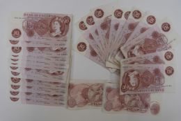 Thirty-three J Hollom ten shilling notes, largely almost uncirculated, includes some consecutive