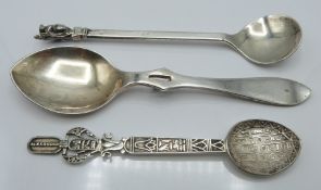 Three spoons comprising hallmarked silver jam spoon, Egyptian white metal example with hieroglyph