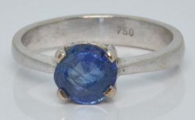 An 18ct white gold ring set with a round cut Sri Lankan sapphire of approximately 0.85ct, 3.0g, size