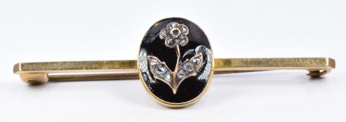 A late Victorian 9ct gold brooch set with black enamel and diamonds in the form of a flower
