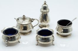 Hallmarked silver three piece cruet set with blue glass liners, Birmingham 1956 maker F C Richards