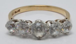 A 9ct gold ring set with five white sapphires in vintage box, size R