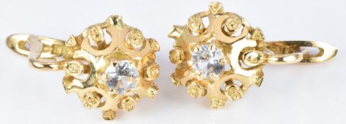 A pair of 18ct gold earrings set with paste, 4.6g