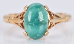 A 9ct gold ring set with a turquoise cabochon, 2.6g, size K