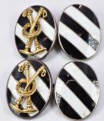 A pair of silver Asprey cufflinks set with black and white enamel with applied gold mallets and