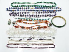 A collection of beaded necklaces including glass, pearls, malachite, agate, amethyst etc