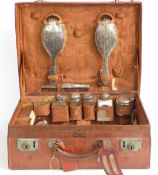 George V leather gentleman's travelling case with hallmarked silver and silver mounted glass