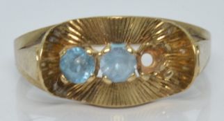 A yellow metal ring marked 333, 2.0g, size O