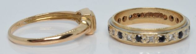 A 9ct gold eternity ring set with diamonds and sapphires (size K) and a 9ct gold ring set with a