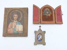 Three icons/ reliquaries including a porcelain portrait miniature plaque in brass easel frame and